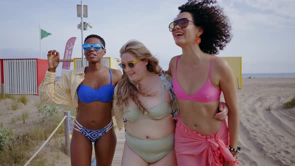 young women having fun on the beach