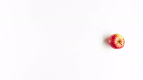 Stop motion animation flat lay top view of tree red apples that depict mid-line ellipsis on white alt