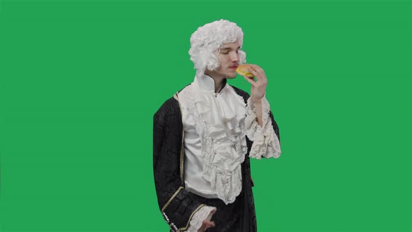 Portrait of Courtier Gentleman in Black Historical Vintage Suit and Wig Savoring Scent of