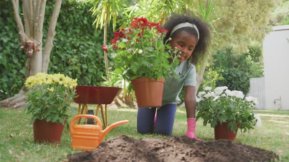 Little girl gardening during a sunny day