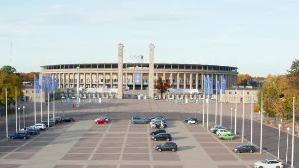 Parking Lot in Front of Stadium in Berlin, Germany, Aerial Wide Shot Dolly Forward Establisher