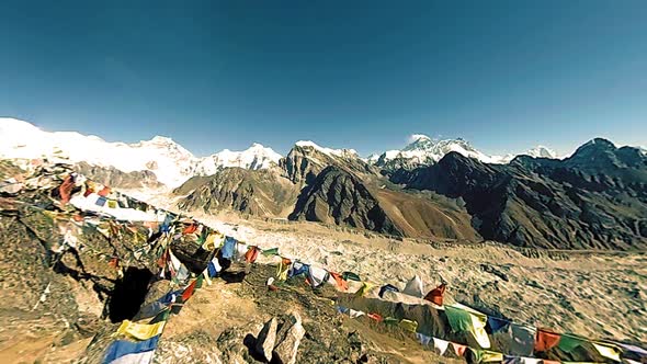 Gokyo Ri Mountain Top. Tibetan Prayer Buddhist Flag. Wild Himalayas High Altitude Nature and Mount