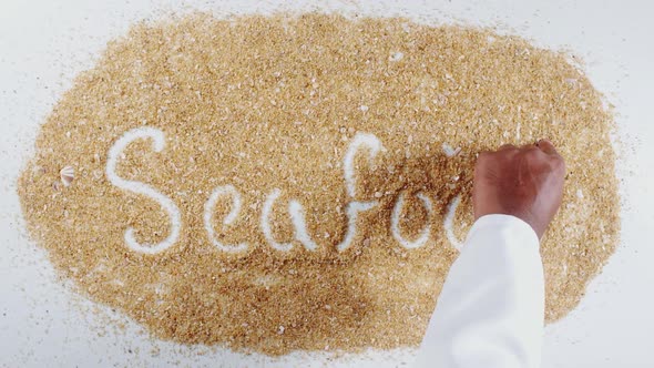 Hand Writes On Beach Sand Sea Food