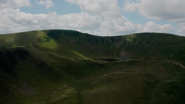 Aerial Drone Top View. Green Mountains Without Trees, Lake in the Mountains Svydovets Dragobrat