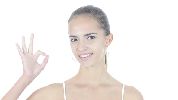 Ok Sign by Young Woman, White Background