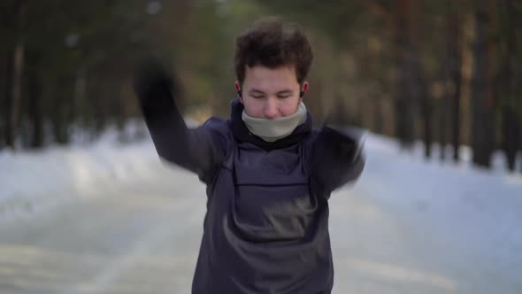 Boy in the Sportswear Doing Exercises Outdoors in Pine Forest. Healthy Lifestyle Sport Concept