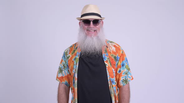 Happy Mature Bearded Tourist Man with Sunglasses Smiling