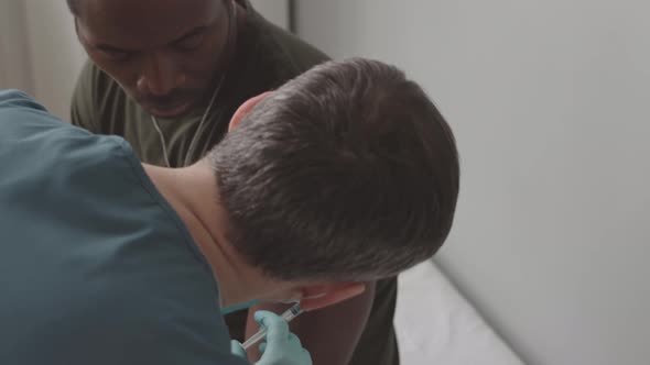 African American Soldier Being Vaccinated against Covid alt