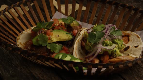 Rotating shot of delicious tacos on a wooden surface - BBQ 153