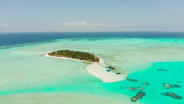 Tropical Island with a Beach on the Atoll