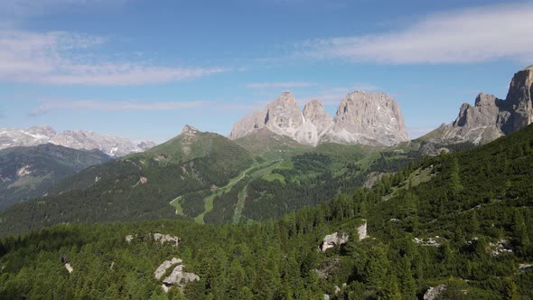 Aerial drone view in Dolomites. Italy nature with forest and rocks. High mountains and cliffs