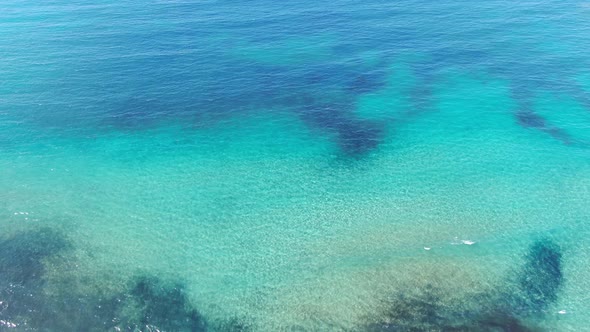 Calm Blue and Turquoise Waves of Mediterranean Sea. Crystal Clear Water on Tourist Resort on Cyprus