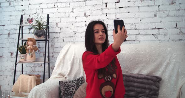 Wonderful Girl Holds Smart Phone Make Video Call on Christmas Eve Congratulates Relatives 2021 Enjoy