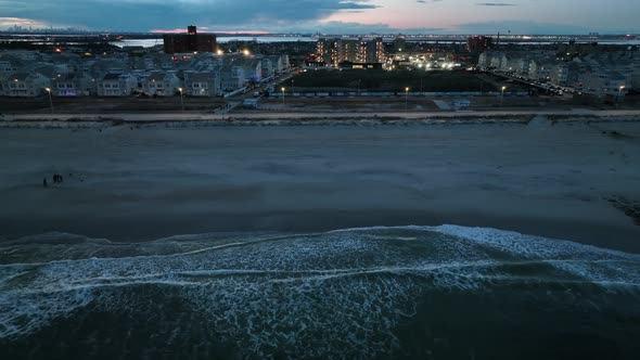 An aerial view of a beach in Arverne, NY in the evening. The camera truck left over the Atlantic Oce