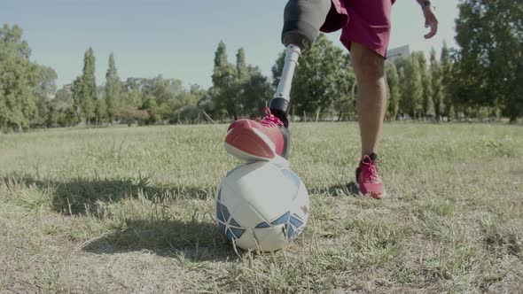 Vertical Motion of Disabled Man Putting His Leg on Ball