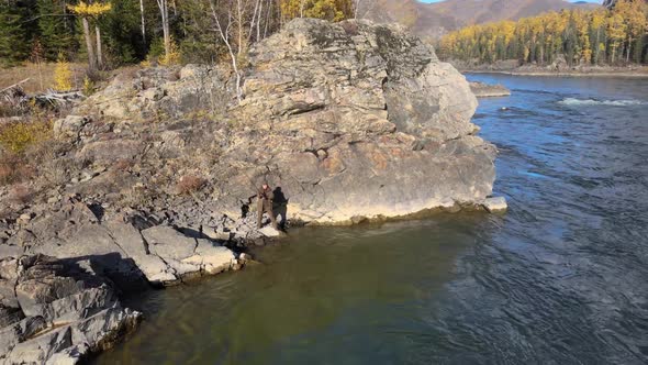 Fisherman Fishing at the Edge of a Cliff Fishing Rod