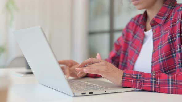 Hands of African Woman Working on Laptop