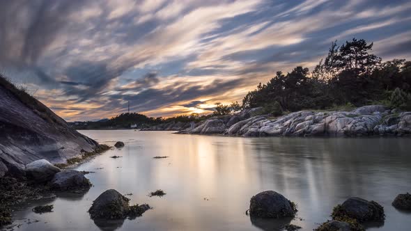 Timelapse of sunset at fjord near Grimstad, Agder, Norway