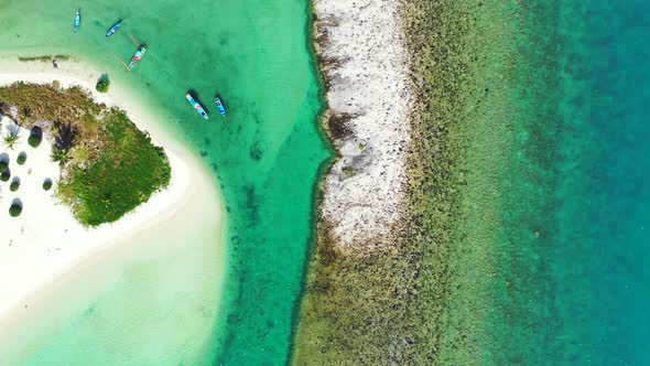 Beautiful coral reef and sandbank with tropical vegetation on Thailand. Aerial