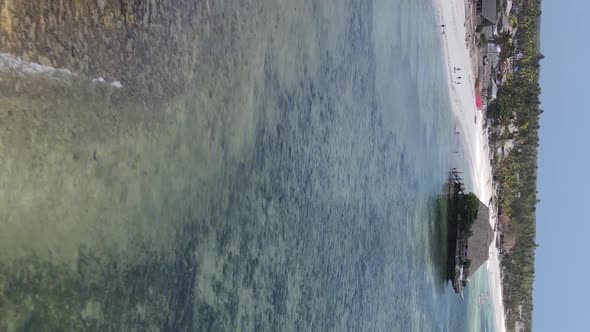 Vertical Video House on Stilts in the Ocean on the Coast of Zanzibar Tanzania Aerial View