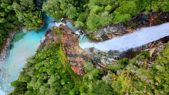 Overhead view of the Rio Blanco waterfall surrounded by the forest of Hornopiren National Park, Chil