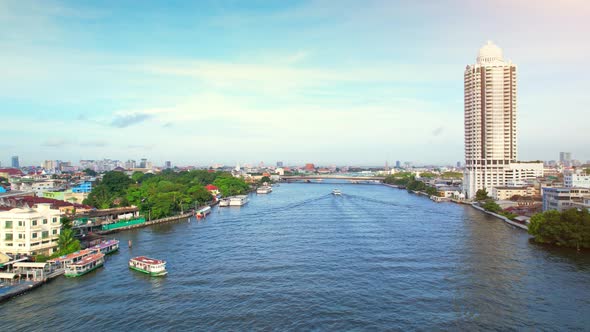 4K : Drones fly over the Chao Phraya River, buildings and business districts