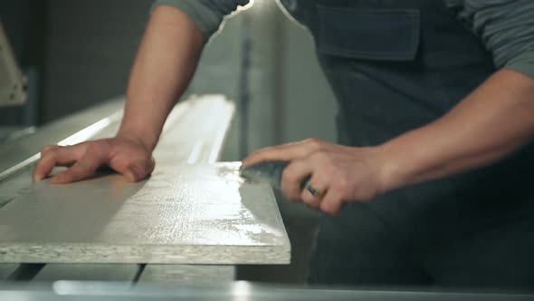 Man Working with Sandpaper