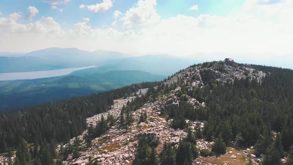 Landscape - Rocky Mountains and a Forest - Cloudy Sky