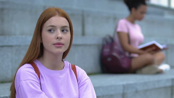 Thoughtful Redhead Teen Female With Rucksack Sitting on Academy Stairs, Student