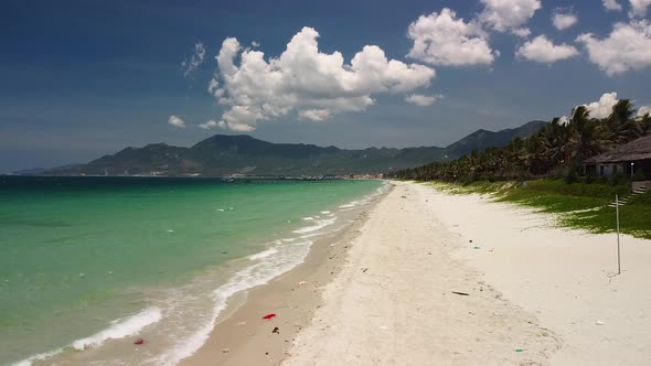 Scenic Fly Over a Tropical White Sand Beach Island in Asia on Summer Day.