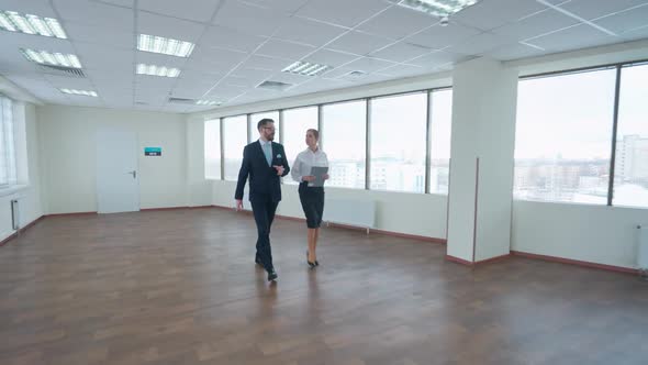 Couple of Top Managers Goes to a Business Meeting the Interior of a White Office Space with