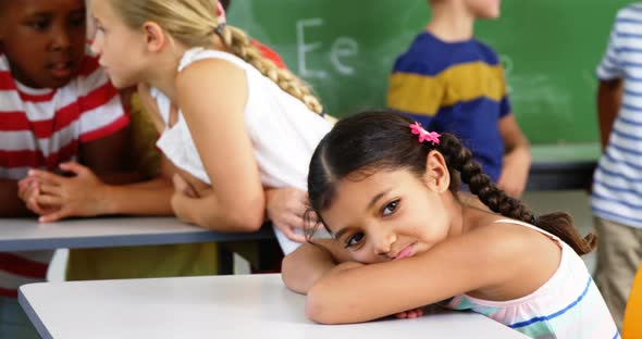 School kids interacting with each other in classroom