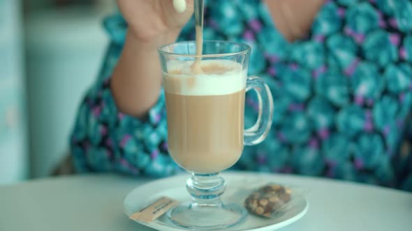 Charming Woman Drinking Cup Coffee In Cafeteria. Breakfast With Cappuccino In Restaurant.