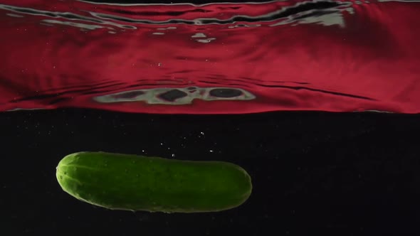 Cucumber Falls Into the Water in Slowmotion