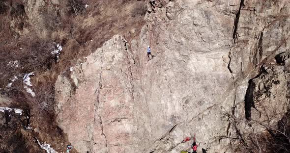 A Group of People are Engaged in Rock Climbing