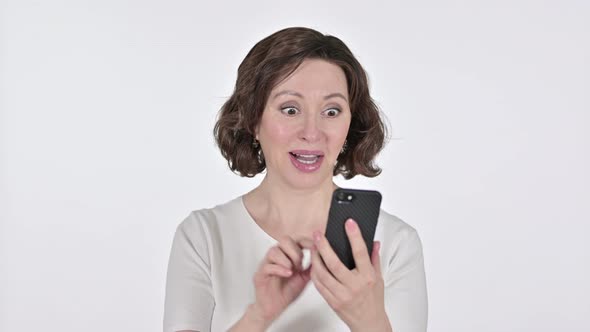 Old Woman Celebrating on Smartphone, White Background 