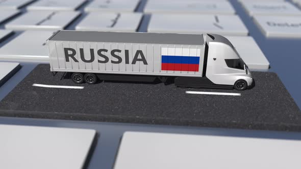 Flag of Russia on Moving Truck and Computer Keyboard