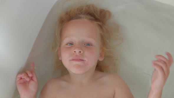 Happy Kid Enjoying the Bath