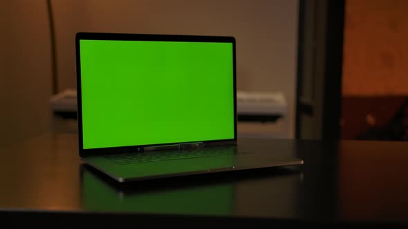 Notebook Showing Green Screen Stands on a Desk Copy Space for Pasting