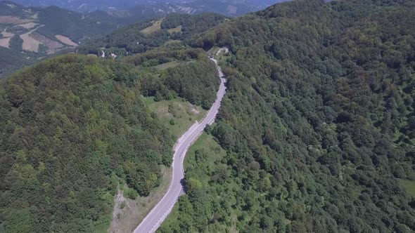 Aerial view of a winding mountain road in Italy