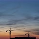 Sunset Time Lapse with Clouds and House Roof with Cranes - VideoHive Item for Sale