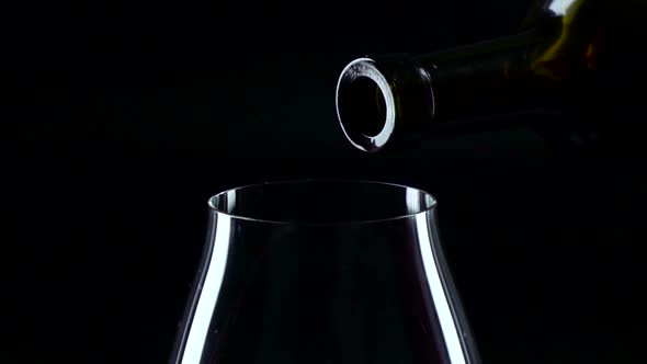 Bottle and Glass with Red Wine, Black, Closeup, Slowmotion