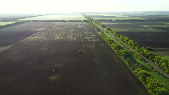 Aerial Drone View Flight Over Different Agricultural Fields Sown