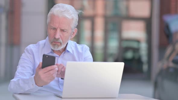 Outdoor Old Man Using Smartphone and Laptop