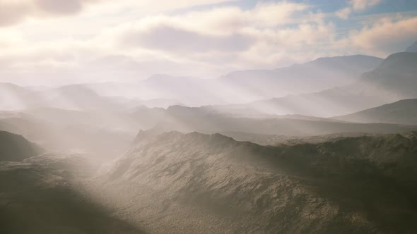 Aerial Vulcanic Desert Landscape with Rays of Light