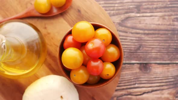 Cherry Tomato Cheese and Olive Oil on Table