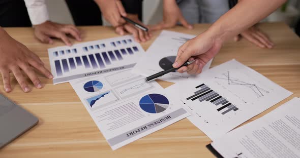 Businesswoman pointing and explaining the information