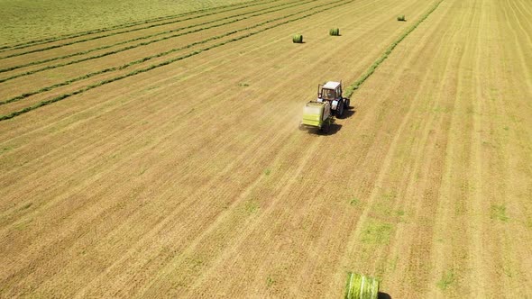 Agricultural process of modern machinery in the field.