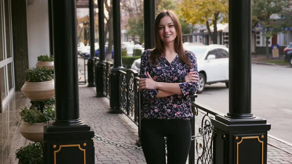 Young Confident Beautiful Businesswoman Looking at Camera, Happy and Smile on the Street