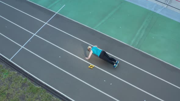 Aerial Shot of Overweight Woman Doing Push Ups